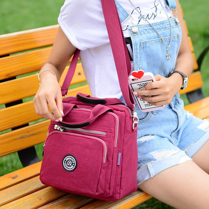 Rote Damen-Schultertasche aus Nylon, wasserdicht, modisch, ideal für Freizeit und Reisen.