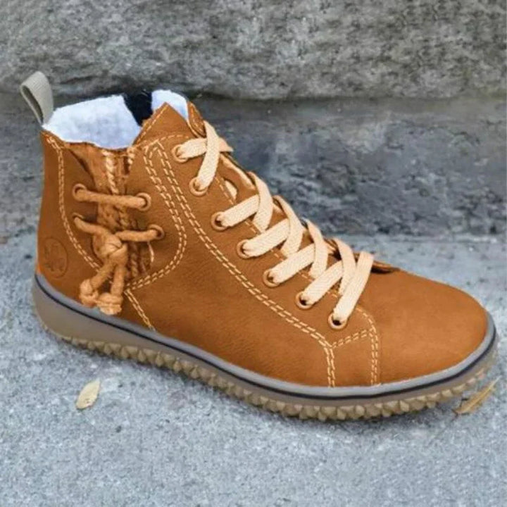 Brauner Damen-Winterstiefel aus Leder mit Schnürung, warm gefüttert, rutschfeste Sohle.