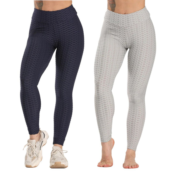 Zwei Damen in nahtlosen, texturierten Leggings, dunkelblau und hellgrau, Sportmode.