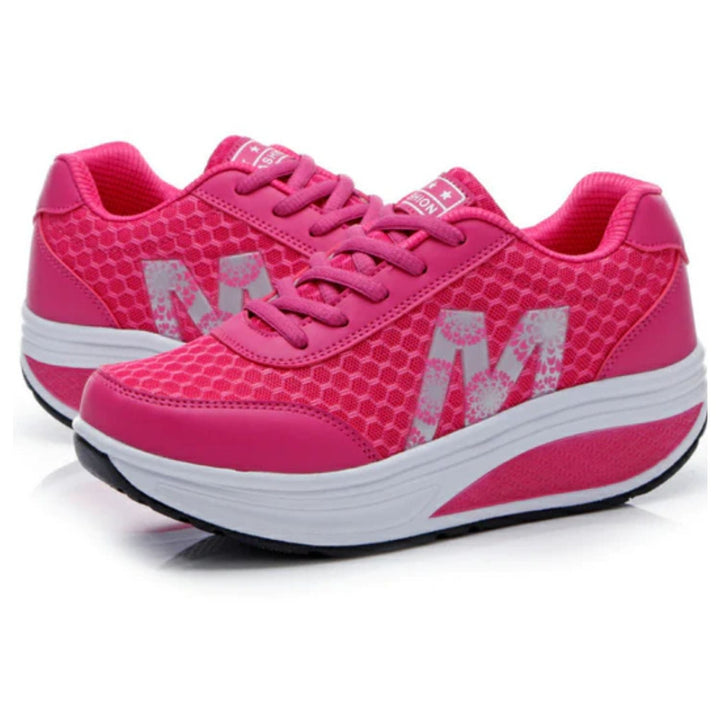 Pinkfarbene Sportschuhe mit gepolsterter Sohle, atmungsaktivem Mesh, ideal für Damen.