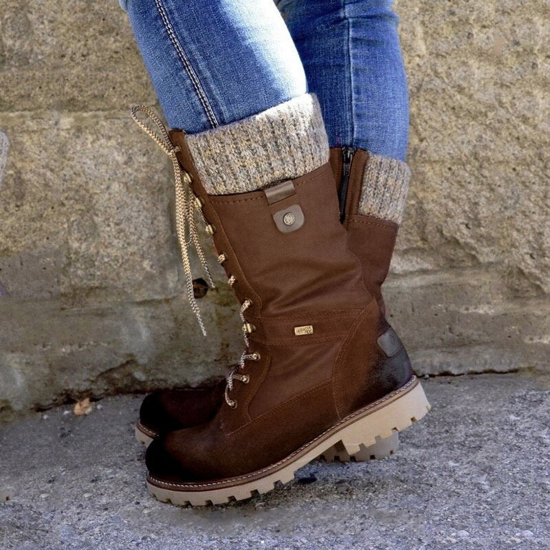 Braune Damen-Winterstiefel, Leder, Schnürung, warme Fütterung, robuste Sohle, Outdoor geeignet.