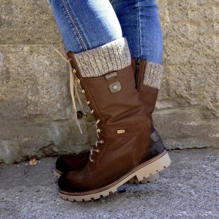 Braune Damen-Winterstiefel, Leder, Schnürung, warme Fütterung, robuste Sohle, Outdoor geeignet.