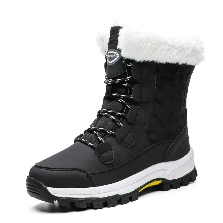 Schwarze Damen-Winterstiefel, mittelhoch, mit weißem Kunstfell, rutschfeste Sohle.