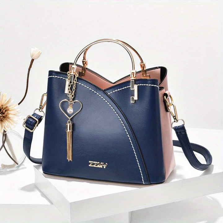Damenhandtasche aus Leder, blau-rosa, mit Herzanhänger, modisch, elegant, für Alltag.