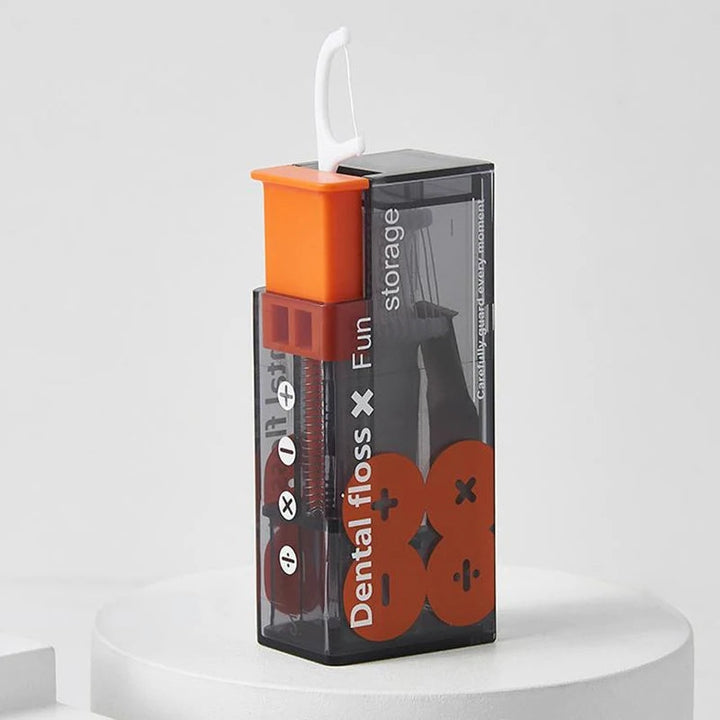 Transparente Zahnseidebox mit orangem Deckel, modernes Design, praktische Aufbewahrung.