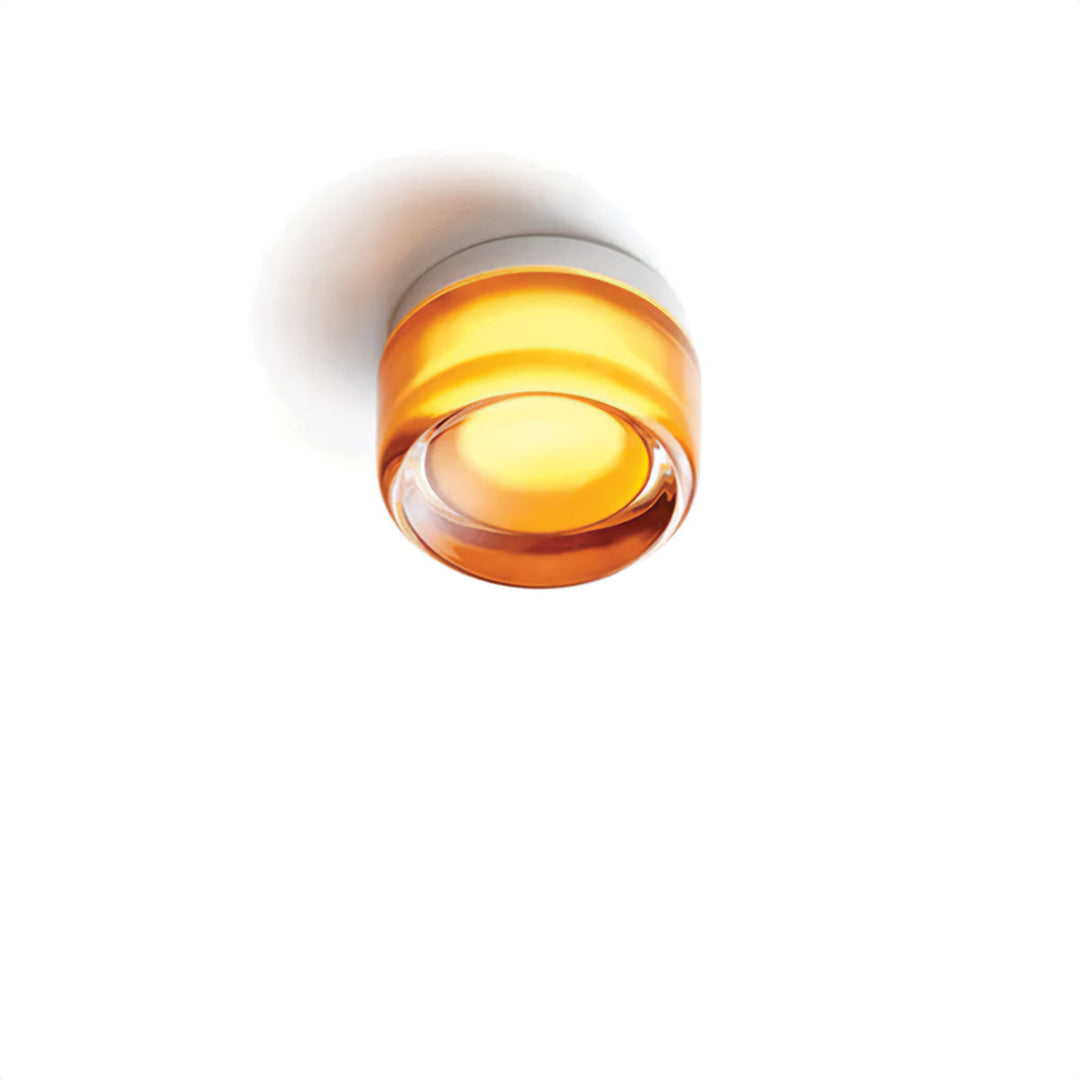 Moderne Deckenleuchte aus bernsteinfarbenem Glas, minimalistisch, rund, für Wohnräume.