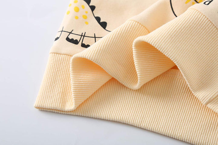 Beige Kinderpullover mit Dinosaurier-Design, Baumwolle, gerippt, modisch, bequem.
