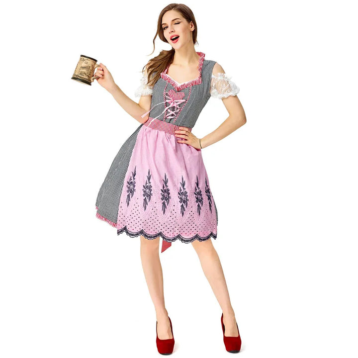 Frau im rosa Dirndl mit Bierkrug, Oktoberfest-Kleidung, traditionell, festlich, bayerisch.