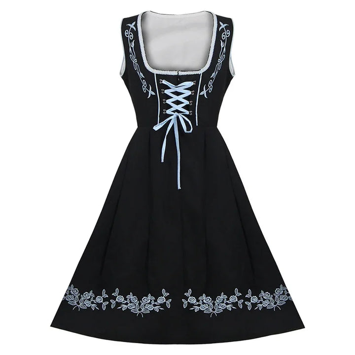 Schwarzes Dirndlkleid mit blauer Stickerei, traditionell, ärmellos, Schnürung vorne.