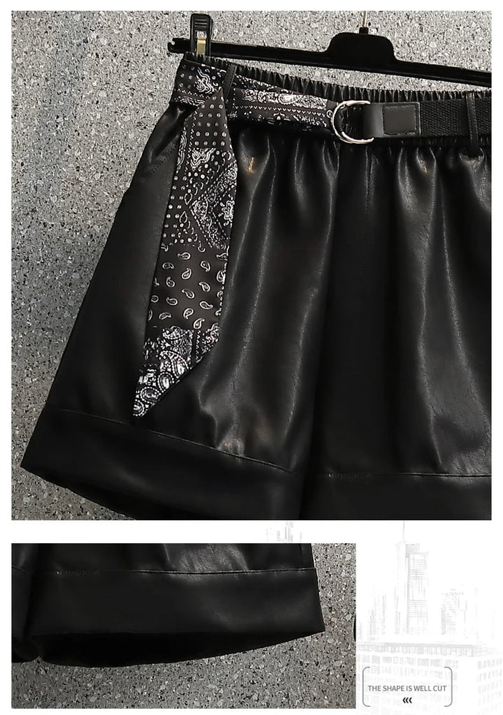 Schwarzer Lederrock mit Gürtel und Paisley-Muster, modisch, elegant, Damenbekleidung.