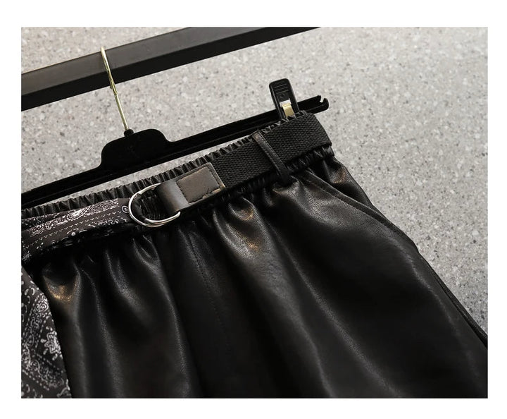 Schwarzer Lederrock mit Gürtel, D-Ring, elastischem Bund, modisch, elegant, Damenmode.