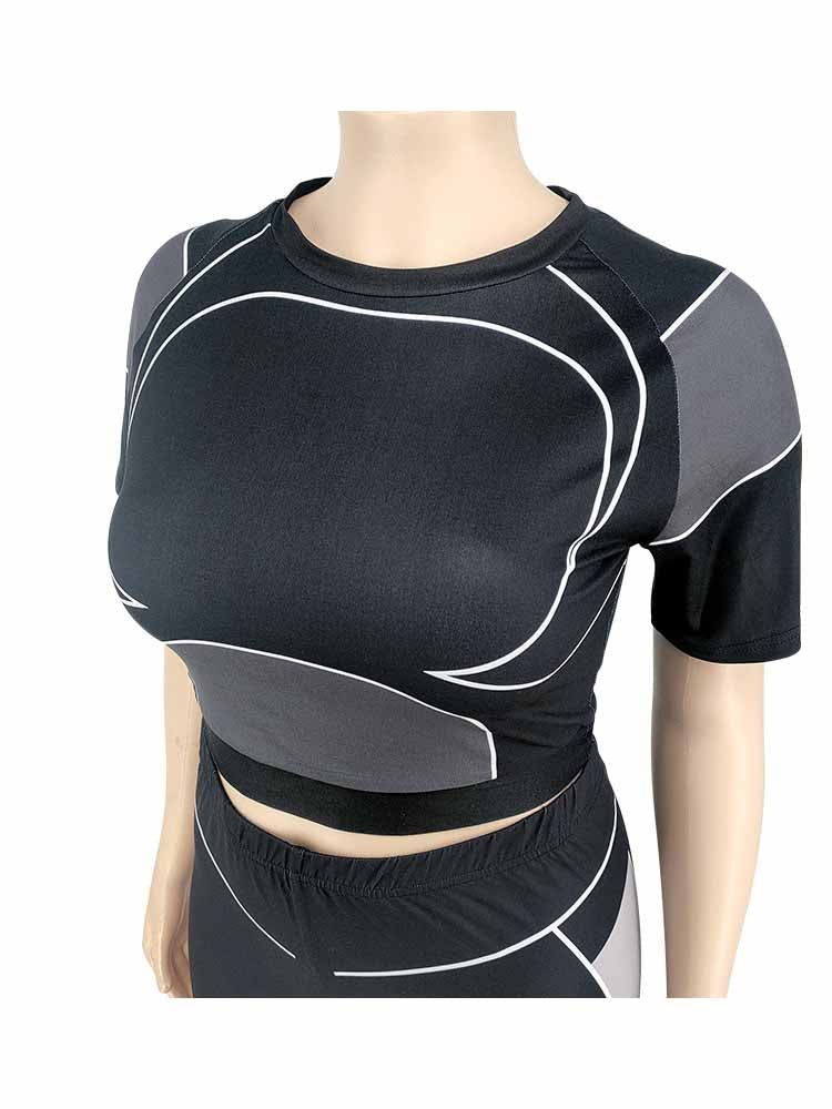 Schwarzes Damen-Sport-Set, kurzärmeliges Oberteil, geometrisches Muster, elastisches Material.