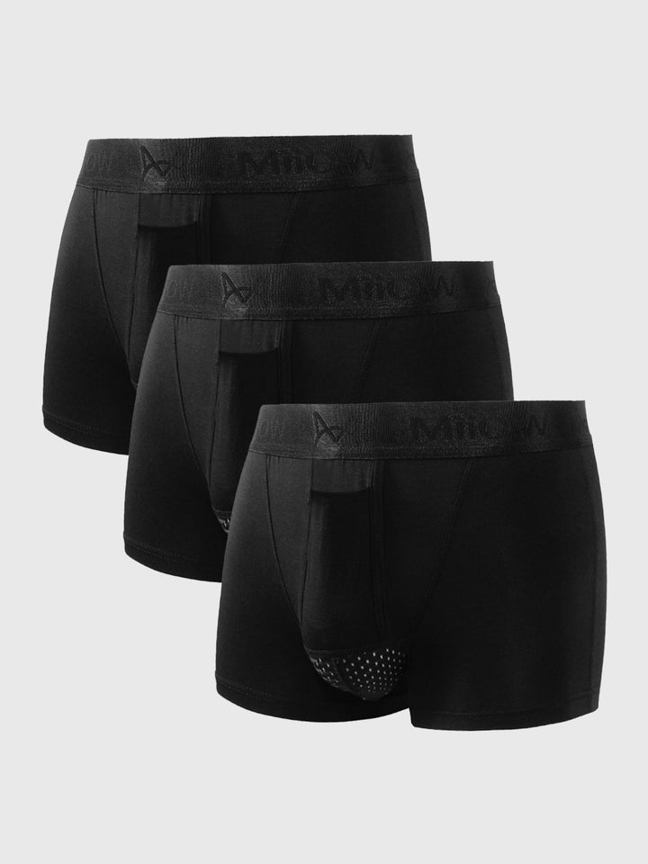 Drei schwarze Herren-Boxershorts aus Baumwolle mit elastischem Bund, Vorderansicht.