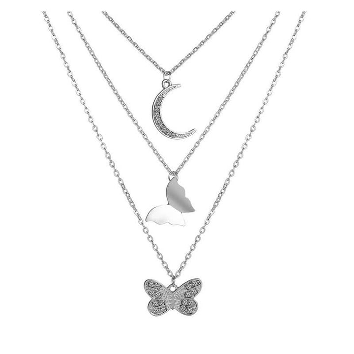 Silberne Halskette mit Mond- und Schmetterlingsanhängern, modischer Schmuck für Damen.