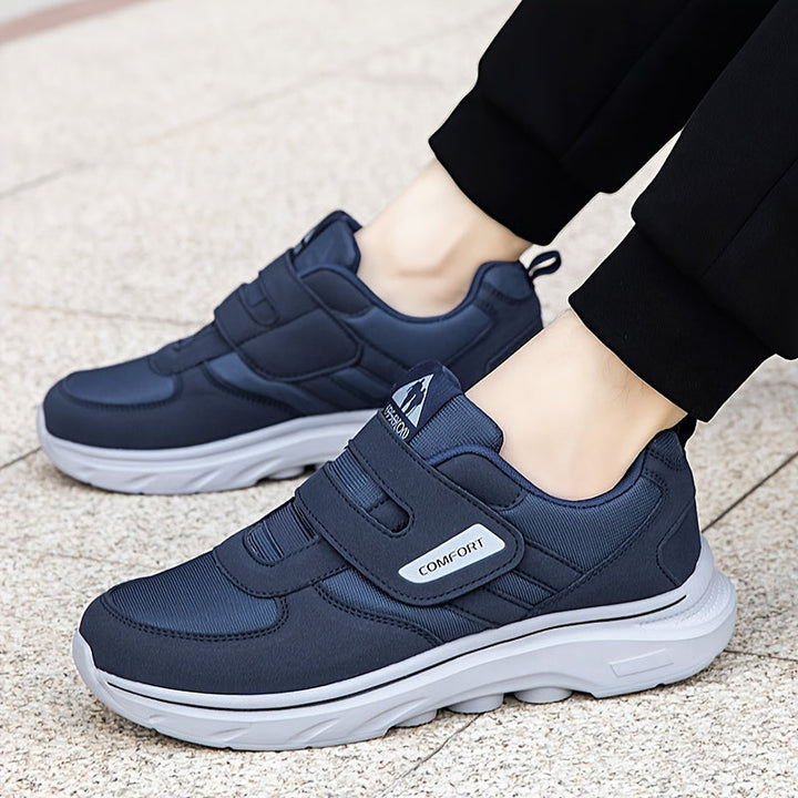 Dunkelblaue Herren-Sneaker mit Klettverschluss, bequeme Sportschuhe, rutschfeste Sohle.