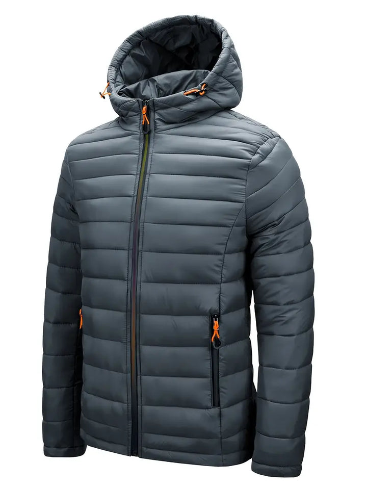 Dunkelgraue Steppjacke mit Kapuze, Reißverschluss, orange Details, Herrenmode, Winterjacke.