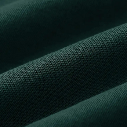 Dunkelgrüner Baumwollstoff, Nahaufnahme, Textur, hochwertiges Material für Kleidung.