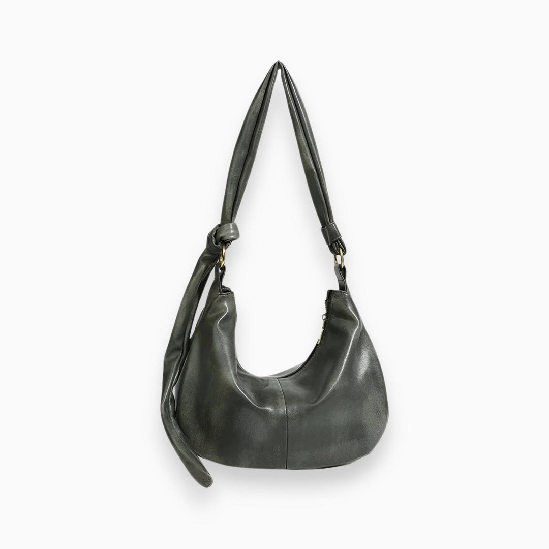 Grüne Ledertasche mit Knotenriemen, modische Damenhandtasche, elegantes Design.