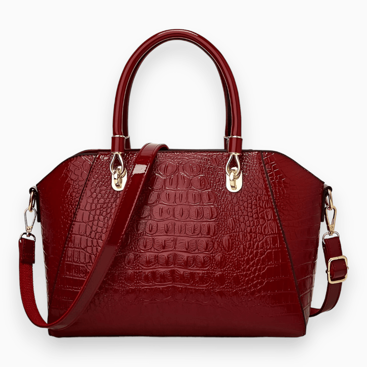 Rote Damenhandtasche aus Leder mit Krokodilprägung, abnehmbarer Schulterriemen, goldene Beschläge.