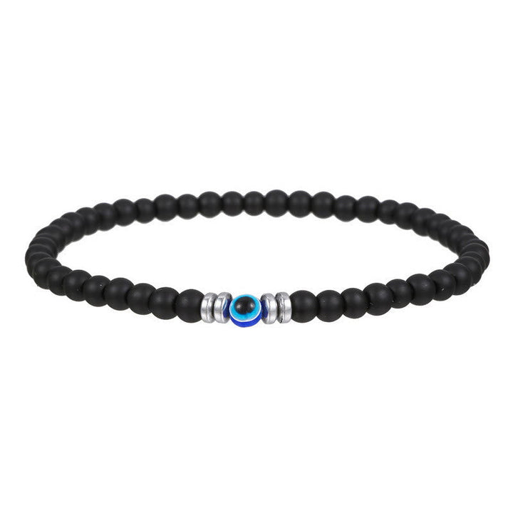 Schwarzes Perlenarmband mit blauem Auge, silberne Akzente, Unisex-Schmuck, modisch.