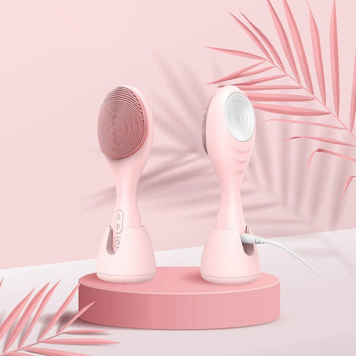 Rosa elektrischer Gesichtsreiniger aus Silikon, USB-betrieben, vier Lichtmodi.