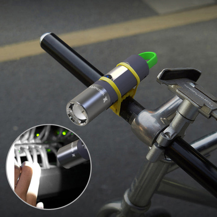 Fahrradlampe LED, grau, am Lenker montiert, ideal für Nachtfahrten, wasserdicht, USB-aufladbar.