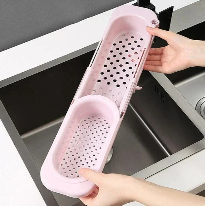 Rosa ausziehbares Abtropfsieb über Spüle, Kunststoff, Küchenzubehör, verstellbar, platzsparend.