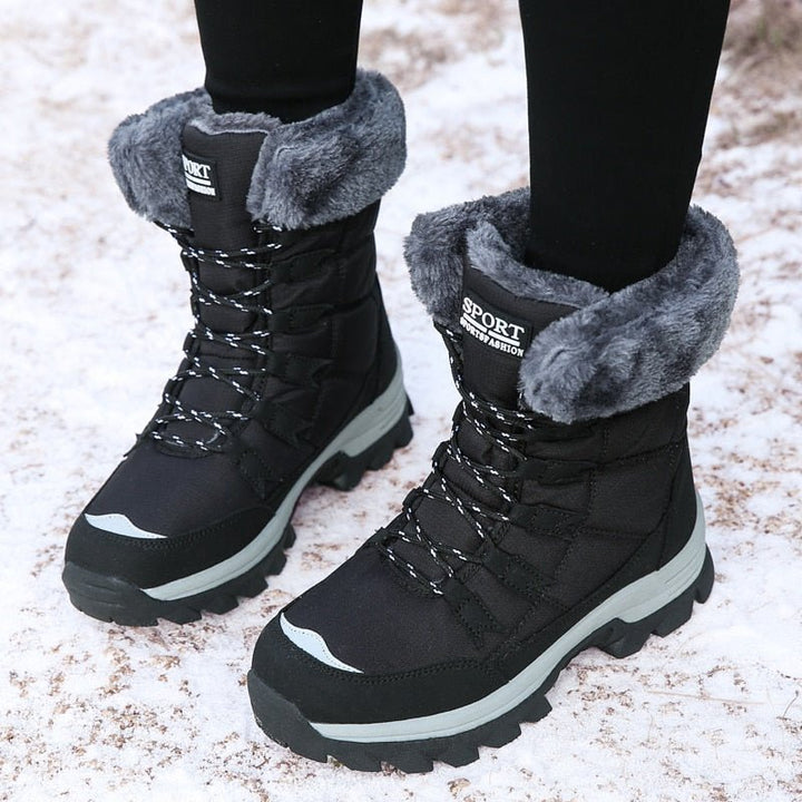 Schwarze Winterstiefel mit grauem Kunstfell, rutschfeste Sohle, warm, wasserdicht, Damenmode.