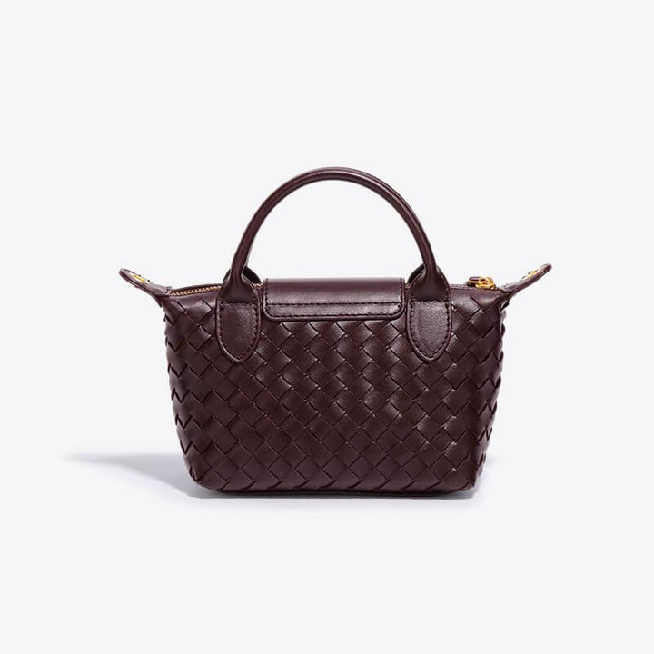 Braune geflochtene Handtasche aus Leder, elegant, modisch, Damenaccessoire, stilvoll.