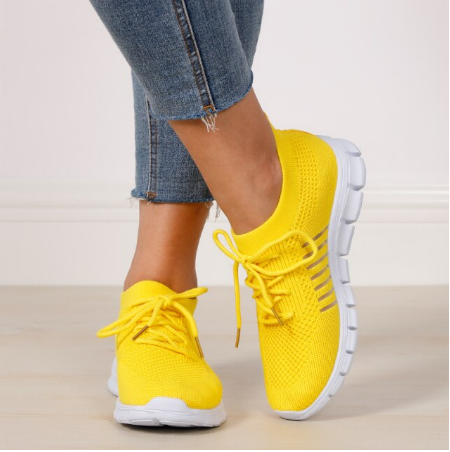 Gelbe Damen-Sneaker aus Mesh, bequem, atmungsaktiv, mit weißer Sohle, modisch.