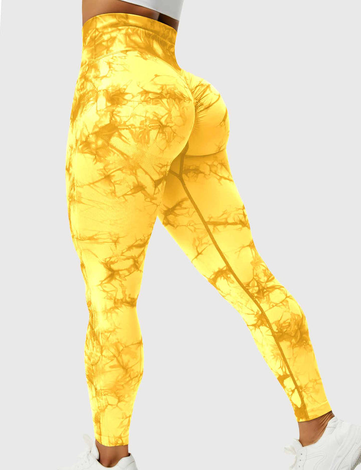 Gelbe Damen-Leggings mit Batikmuster, hoher Bund, elastisch, ideal für Sport und Freizeit.
