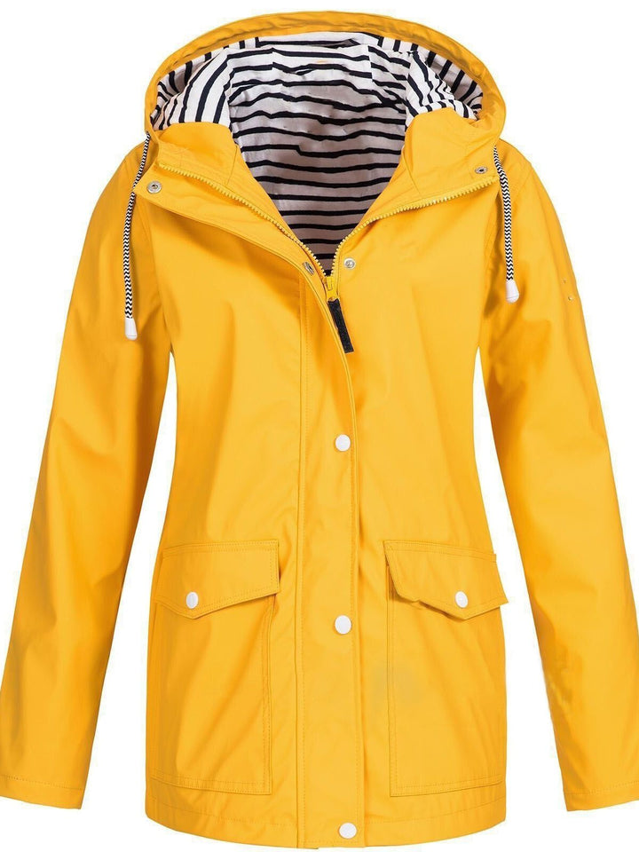 Gelber Damen-Trenchcoat mit Kapuze, langen Ärmeln, gestreiftem Innenfutter, 2023 Mode.