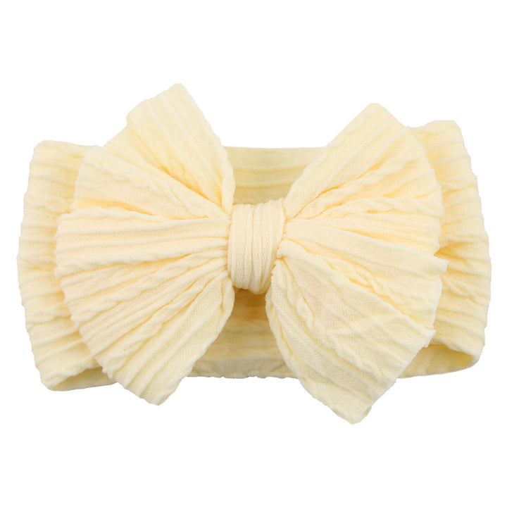Gelbes Baby-Stirnband mit großer Schleife, weiches Baumwollmaterial, modisches Accessoire.