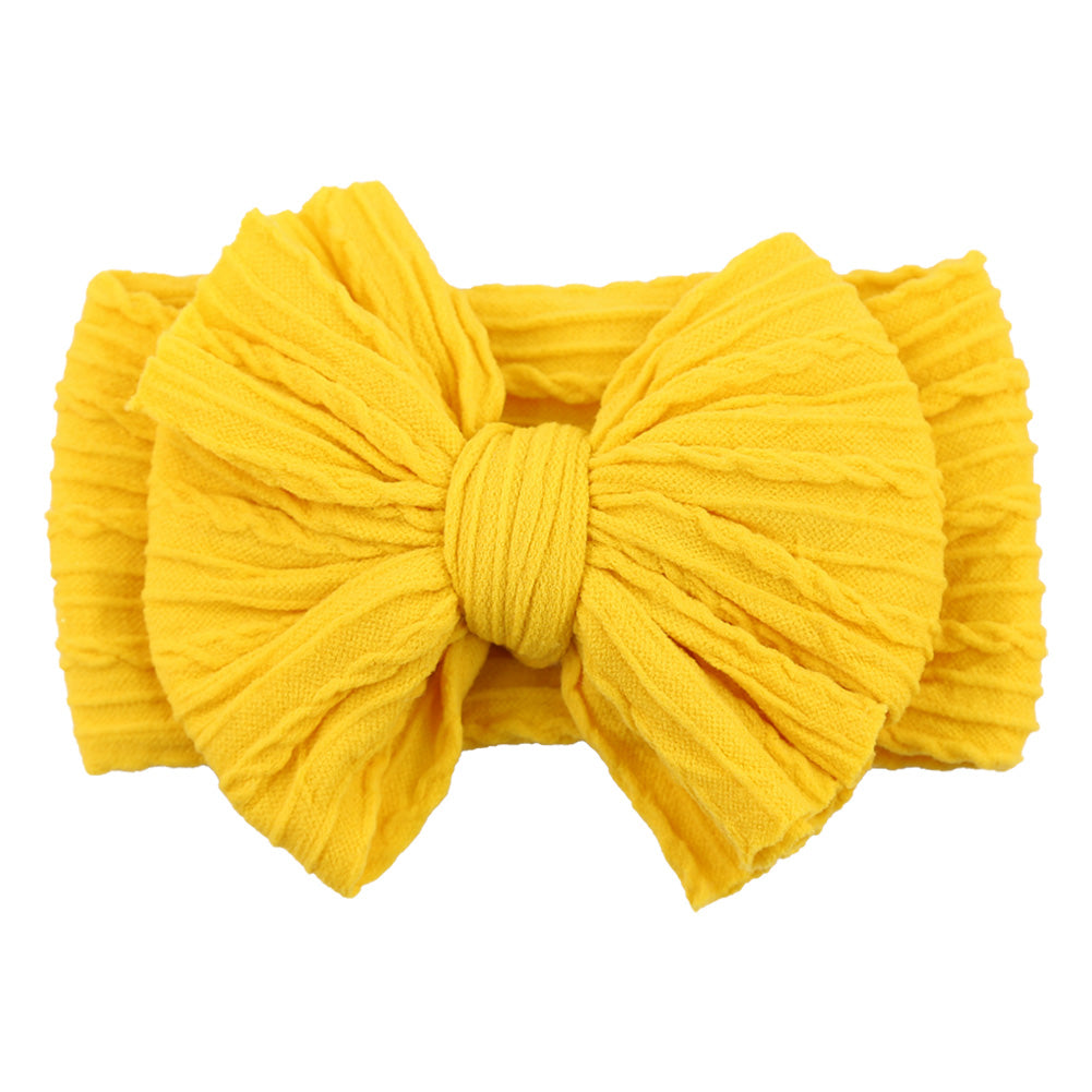 Gelbes Stirnband mit großer Schleife, Baumwolle, modisches Accessoire für Babys und Kleinkinder.