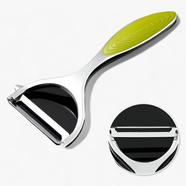 Grüner Gemüseschäler aus Edelstahl mit ergonomischem Griff für effizientes Schälen.