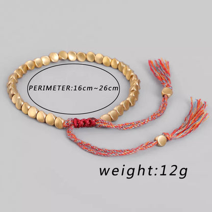 Goldfarbenes Armband mit verstellbarem Umfang, rotem Kordelverschluss, 12g, Modeschmuck.
