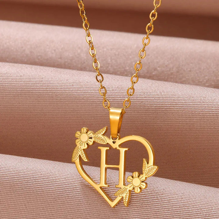 Goldene Herz-Halskette mit Buchstabe H und Blumen, personalisierter Schmuck, Geschenkidee.
