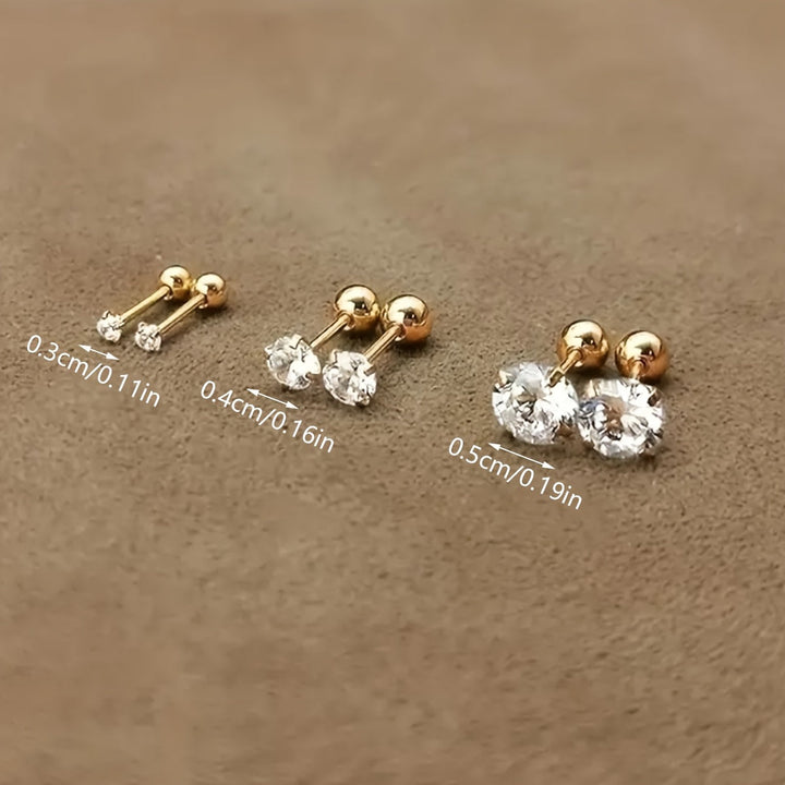 Goldene Ohrstecker mit Zirkonia, drei Größen, funkelnd, elegant, Schmuck für Damen.