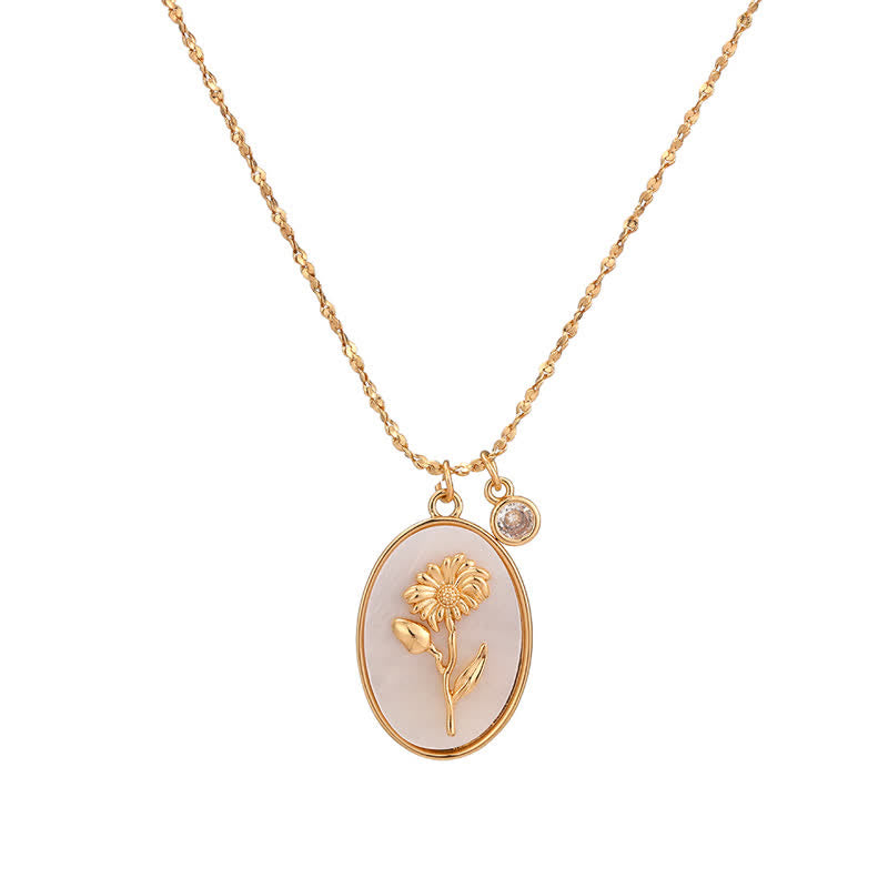 Goldene Halskette mit ovalem Anhänger, Blumenmotiv, Zirkonia, eleganter Schmuck, Damenaccessoire.