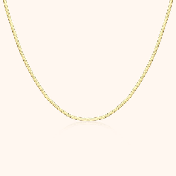 Goldene Schlangenkette, 18 Karat, elegantes Design, Schmuck für Damen, luxuriöses Accessoire.