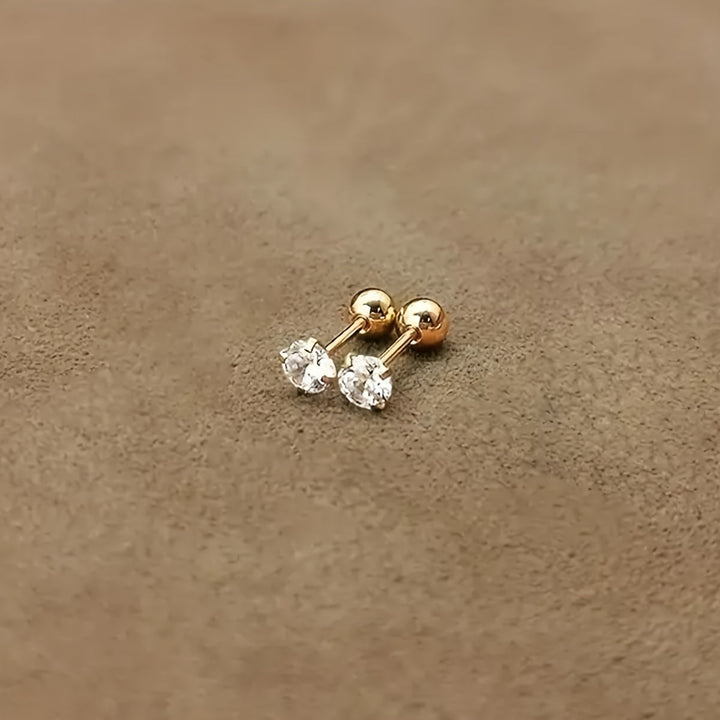 Goldene Ohrstecker mit klaren Zirkonia, Schmuck, minimalistisch, elegant, Damenaccessoire.