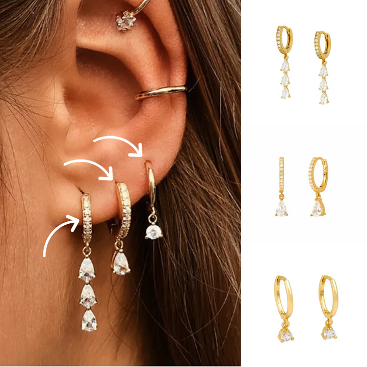 Frau mit goldenen Ohrringen, Tropfenform, Zirkonia, modischer Schmuck, Nahaufnahme.