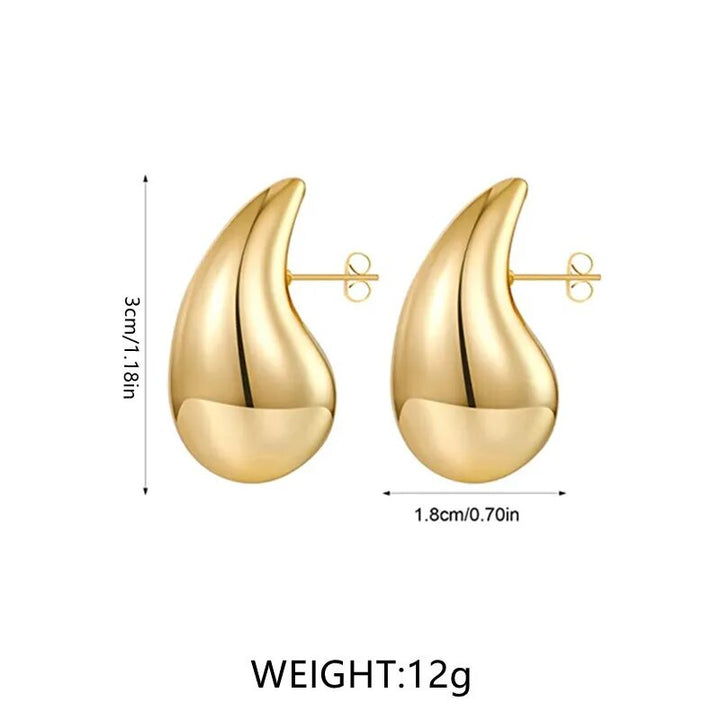Goldene Ohrringe, tropfenförmig, 3cm x 1.8cm, 12g, modisch, elegant, Schmuckaccessoire.