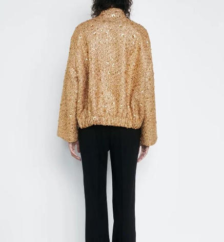 Goldene Paillettenjacke Damen, glänzend, modisch, festlich, Rückansicht, schwarze Hose.