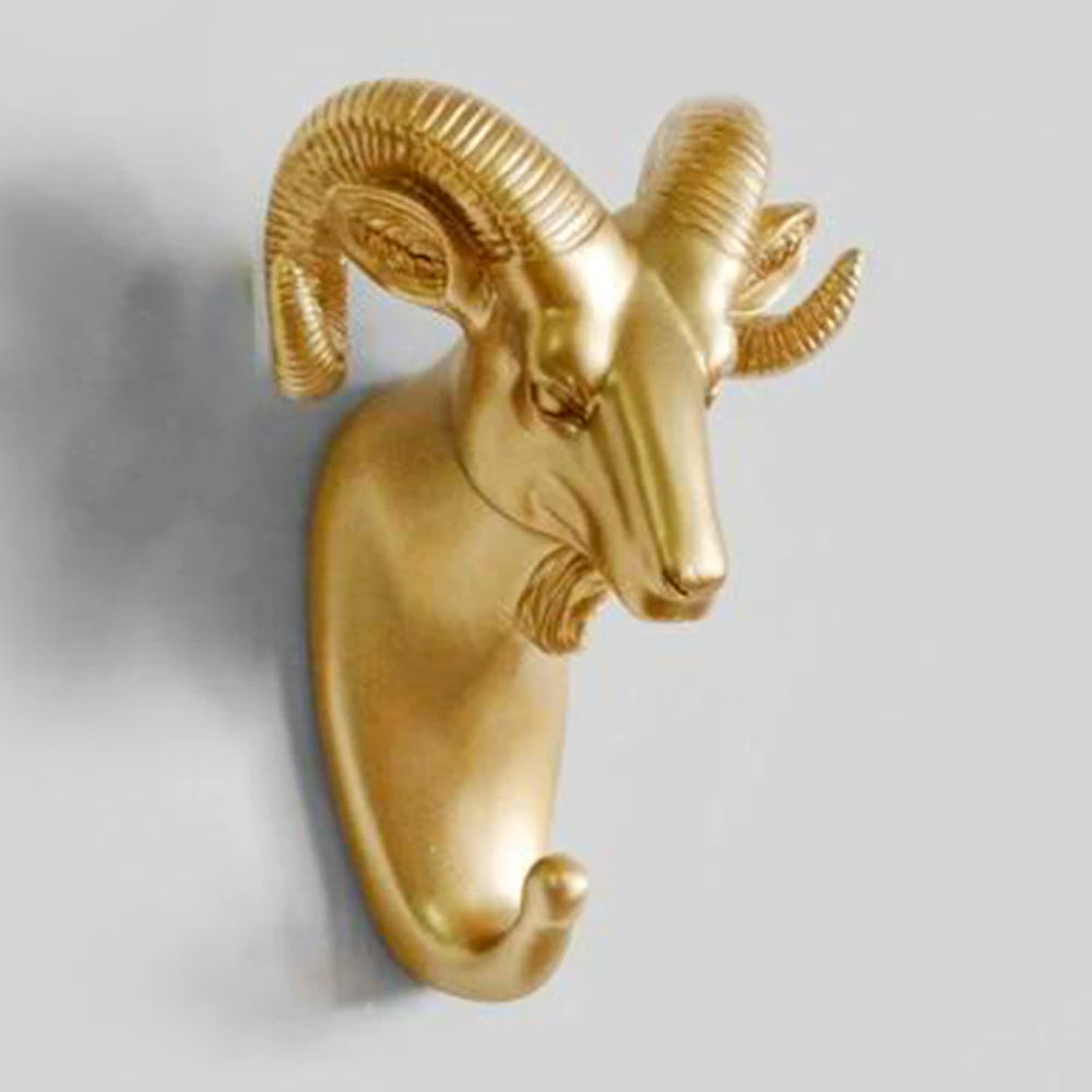 Goldene Widderkopf-Wandhaken, dekorativ, modern, Metall, Wohnaccessoire, stilvoll, einzigartig.