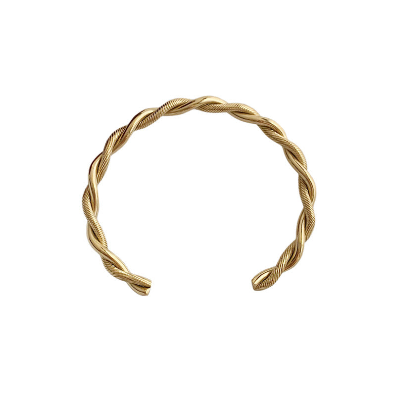 Goldener Edelstahl-Twist-Armreif für Damen, modisches Design, offenes Armband.