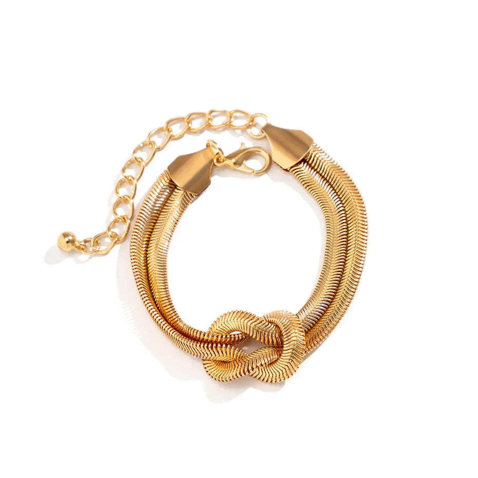 Goldenes Armband mit Knoten-Design, verstellbar, Edelstahl, modisches Schmuckstück.