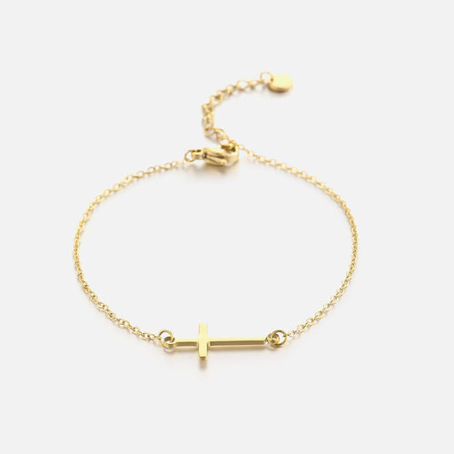 Goldenes Armband mit Kreuzanhänger, verstellbar, elegantes Schmuckstück für Damen.
