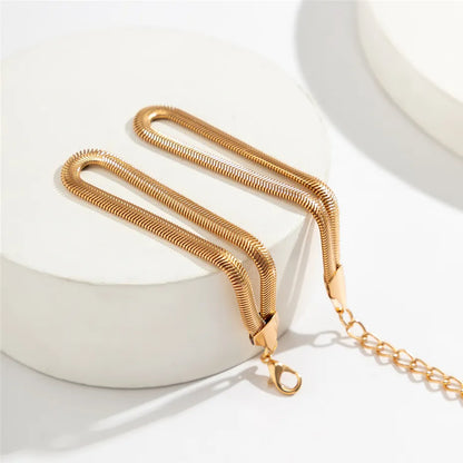 Goldenes Schlangenarmband, Edelstahl, Damenmode, Schmuck, elegantes Design, Geschenkidee