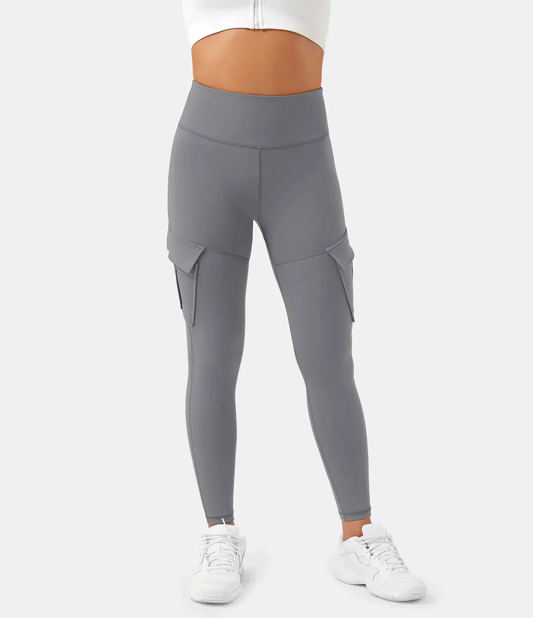 Graue Cargo-Leggings für Damen, hohe Taille, Seitentaschen, sportlich, bequem.